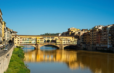 Fototapeta na wymiar Golden reflections of the Ponte Vecchio