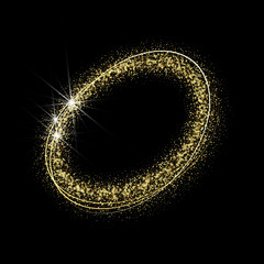  Golden particles of sand in the form of a circle on a black background.