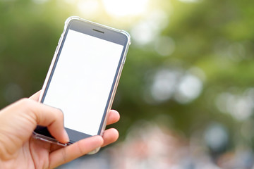 hand holding smart phone with blank screen isolated on white