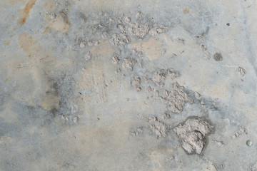 Background and textured of cement floor with cement stains dropped.