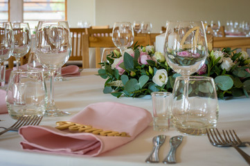 Wedding table decorations with flowers, candles and numbers