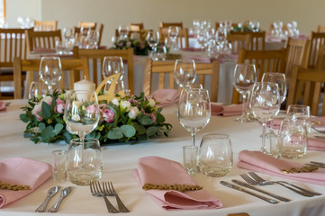 Wedding table decorations with flowers, candles and numbers