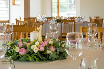 Wedding table decorations with flowers, candles and numbers