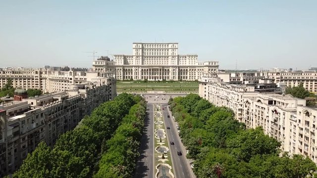 Aerial view moving forward of the Parliament Palace in Bucarest on a sunny day