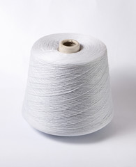 bobbin of yarn on a white background. Side view.Textile reel on isolated white background.