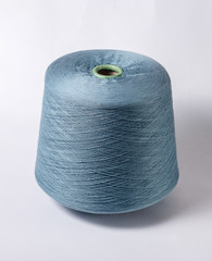 bobbin of yarn on a white background. Side view.Textile reel on isolated white background.