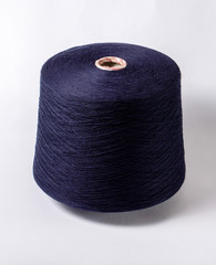 bobbin of yarn on a white background. Side view.Textile reel on isolated white background.