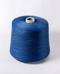 bobbin of yarn on a white background. Side view.Textile reel on isolated white background.