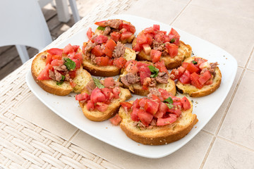 Appetizer of bruschetta with tuna