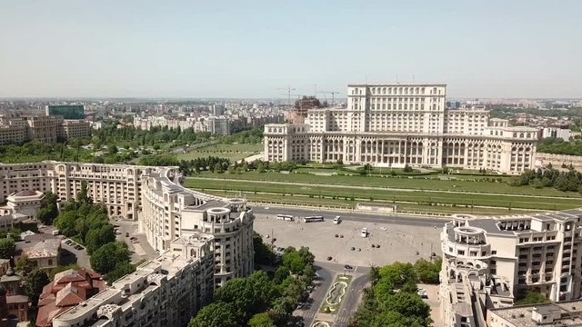 Aerial view moving backward of the Parliament Palace in Bucarest on a sunny day