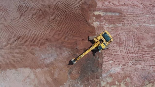 Aerial view excavator working on a construction site.