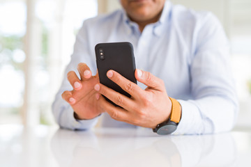 Close up of business man hands using smarpthone
