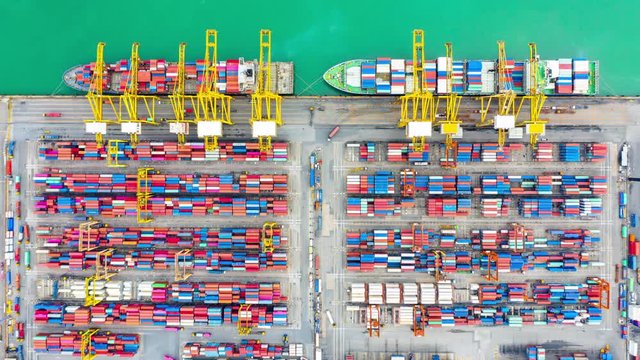 Container ship loading and unloading in deep sea port, Aerial top view of business logistic import and  export freight  transportation by container cargo freight shipping in open sea.