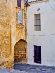 Fototapeta na wymiar Arch of La Segur, Arco de La Segur, in the Marques de Tamaron street. Vejer de la Frontera downtown. Cadiz province, Andalusia, Spain