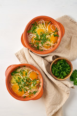 Healthy chicken soup with vegetables and rice noodles, fodmap dash diet, top view