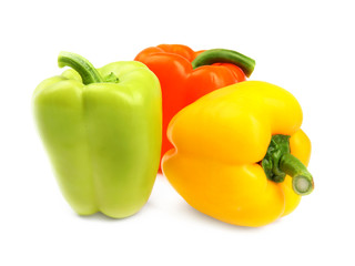 Fresh ripe bell peppers on white background