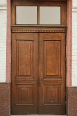 Building with vintage wooden door. Exterior design