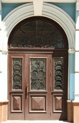 Building with vintage wooden door. Exterior design