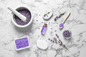 Fototapeta na wymiar Flat lay composition with lavender flowers and natural cosmetic products on marble background