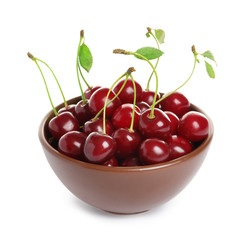 Ceramic bowl of delicious ripe sweet cherries on white background