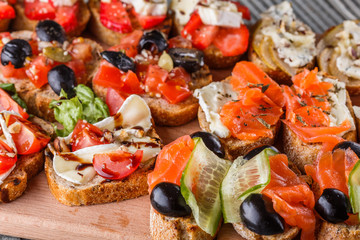Assorted bruschetta Set of various appetizing snacks sandwiches