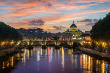 Fototapeta na wymiar Rome skyline in a summer evening, as seen from Umberto I bridge, with Saint Peter Basilica in the background.