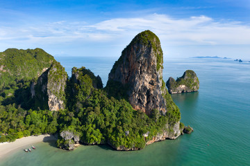 Naklejka premium Aerial view of tropical island, turquoise lagoon and islands on horizon, Krabi, Railay, Thailand.Travelling and holiday concept.