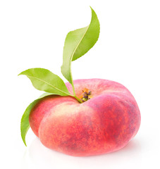 Isolated fruit. One flat peach (donut peach) with leaves isolated on white background with clipping path