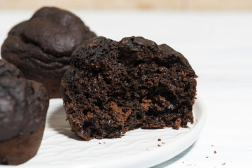 delicious chocolate muffins on a plate in a cut