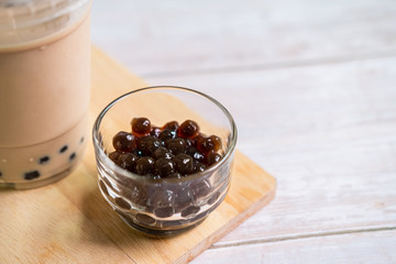 Bubble milk tea on wooden table with copy space