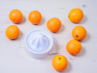 Fresh oranges with juicer pressed manual method.