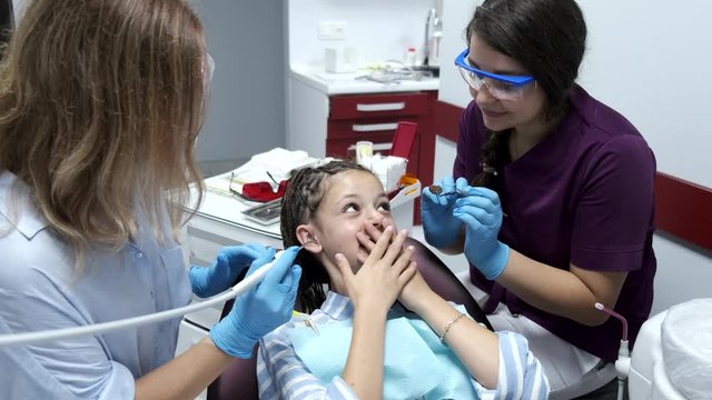 young child at the dentist for her fist cleaning at the dentist office