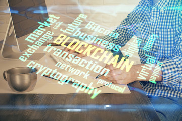 Blockchain theme hud with man working on computer on background. Concept of crypto chain. Double exposure.