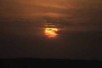 Amman sunset, Amman sunrise, Sun between clouds