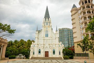 Fototapeta na wymiar White building of a catholic church in europian quarter in Sanya, Hainan, China