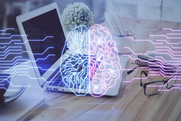 Double exposure of desktop with computer and brain drawing hologram. Artificial intelligence...