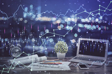 Double exposure of forex chart and work space with computer. Concept of international online trading.