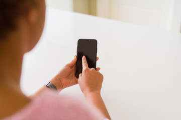 Close up of woman using blank screen of smartphone
