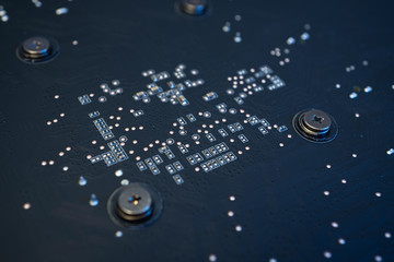 Electronic Circuit Mother Board closeup abstract background.