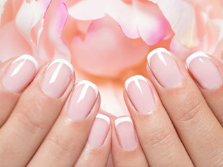 Beautiful woman's nails with french manicure