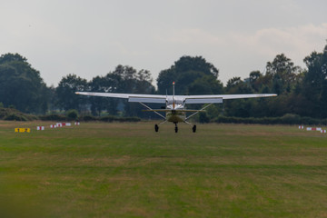 a landing plane on a gray  background