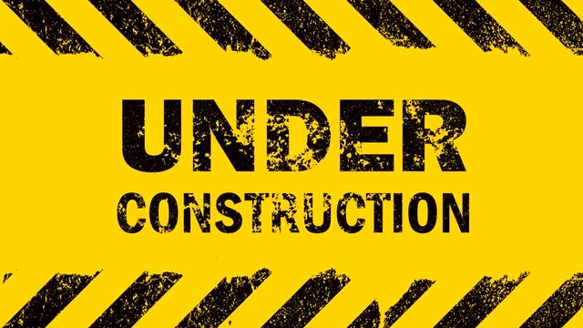 Yellow background with under construction sign