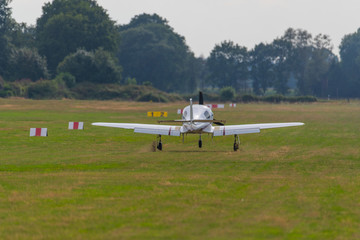 a landing plane on a  small airfield