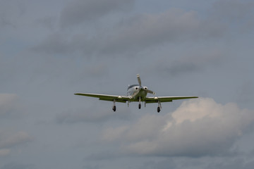 a landing plane on a gray  background