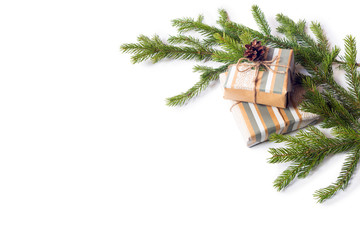Fir branches on a white isolated background. Fir cones on a gift. Greeting card for New Year and Christmas.