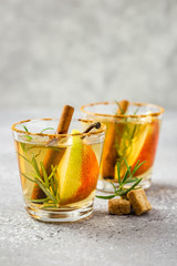 Spiced pear cider with rosemary and cinnamon. Selective focus, copy space.