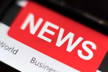 Close up of mobile smart phone with news on screen. Newspaper online portal in browser.
