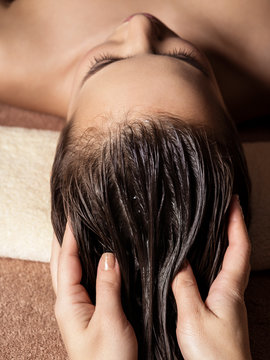 Cosmetologist Massaging Hair On The Head Of The Woman. Spa Treatments.