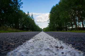 Asphalt road with marking closeup.
