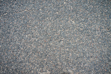 Asphalt texture close up. Stones road surface.